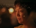 Jennifer Zeng en larmes  lors d’une veillée aux chandelles à Washington consacrée aux pratiquants de Falun Gong persécutés en Chine. (Courtoisie de NTD Télévision)