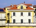 Façade de Numéro Zéro, projet pilote de cohabitation à Turin, en Italie. Ses portes se sont ouvertes le 4 mars 2013, après plus de cinq ans de travail. (Matteo Nobili/cohousingnumerozero.org)