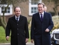 Le premier ministre britannique David Cameron et le président français François Hollande arrivent au sommet bilatéral à Brize Norton près d’Oxford le 31 janvier 2014. (Etienne Laurent/AFP/Getty Images)