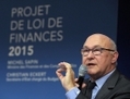Michel Sapin, ministre des Finances présentant le projet de loi de finances 2015, le 1er octobre 2015. (Eric Piermont/AFP/Getty Images)
