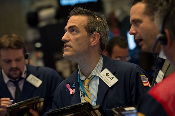 Des traders sur le « floor » de Wall Street à New York le 8 août 2017.  (BRYAN R. SMITH/AFP/Getty Images)