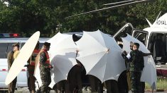 Thaïlande: un 11ème évacué, course contre la pluie pour les derniers