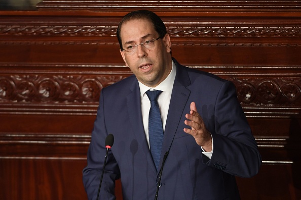 M. Chahed, septième Premier ministre depuis la révolution de 2011 ayant mis fin à des années de dictature, a battu un record de longévité depuis sa nomination fin août 2016.
Au Parlement à Tunis le 28 juillet 2018.
(FETHI BELAID/AFP/Getty Images)