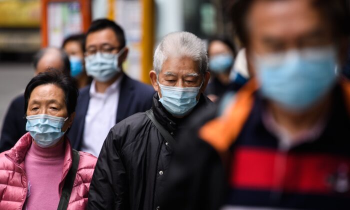 Des habitants de Hong Kong portant des masques de protection le 3 février 2020. (Anthony Wallace/AFP via Getty Images)