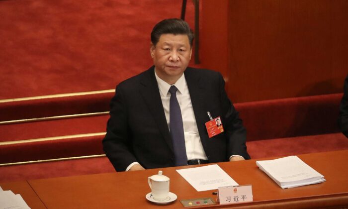 Le dirigeant chinois Xi Jinping assiste à l'ouverture de l’Assemblée nationale populaire au Grand palais du Peuple à Pékin, le 22 mai 2020. (Andrea Verdelli/Getty Images)