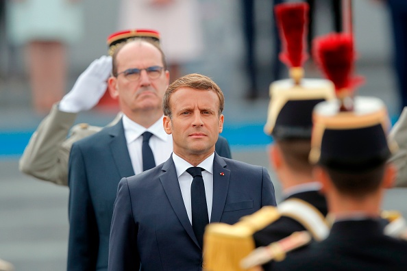 Le Président Emmanuel Macron et le Premier ministre Jean Castex.  (Photo : CHRISTOPHE ENA/AP/AFP via Getty Images)