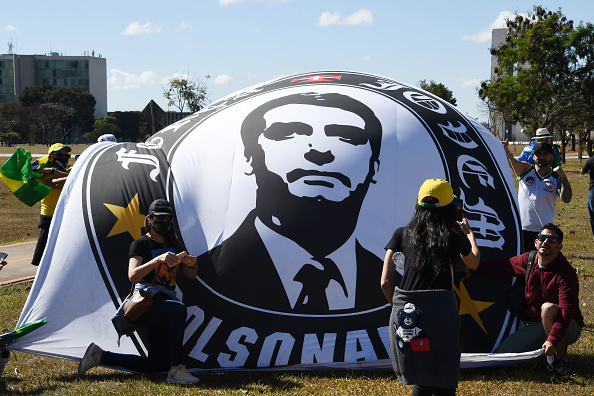-Des groupes évangéliques participent à une manifestation en soutien au gouvernement du président brésilien Jair Bolsonaro devant le Congrès de Brasilia, le 19 juillet 2020. Photo EVARISTO SA / AFP via Getty Images.