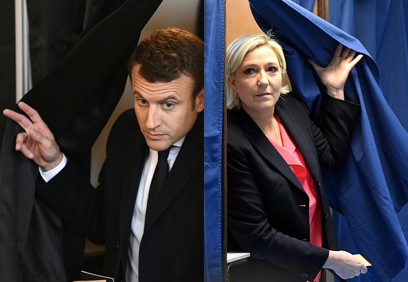 Présidentielle 2022 : Emmanuel Macron et la présidente du RN Marine Le Pen donnés finalistes par un sondage. (Photo : ERIC FEFERBERG,ALAIN JOCARD/AFP via Getty Images)