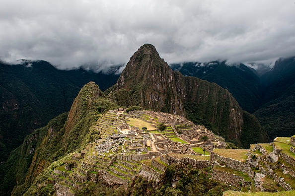 -Près du joyau de la culture inca au Pérou, des pluies ont provoqués des inondations qui ont détruit des maisons, et fait un disparu. Photo ERNESTO BENAVIDES/AFP via Getty Images.