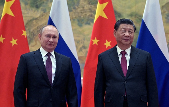Le président russe Vladimir Poutine et le président chinois Xi lors de leur rencontre à Pékin, le 4 février 2022. Photo par ALEXEI DRUZHININ/Sputnik/AFP via Getty Images.