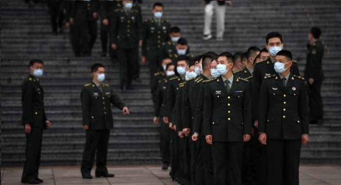 Délégations militaires en formation au Grand Hall du Peuple à Pékin, le 9 octobre 2021. (Noel Celis/AFP via Getty Images)
