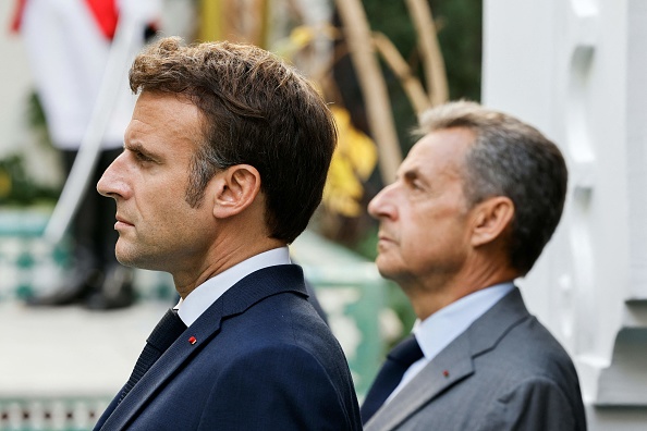 Le Président Emmanuel Macron et l'ex chef de l'État Nicolas Sarkozy.  (Photo : LUDOVIC MARIN/POOL/AFP via Getty Images)