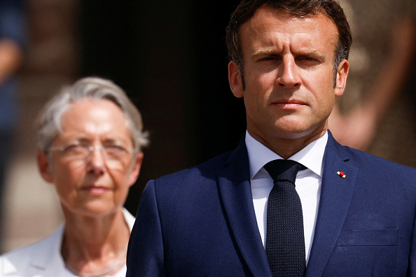 Emmanuel Macron et Elisabeth Borne   (GONZALO FUENTES/POOL/AFP via Getty Images)