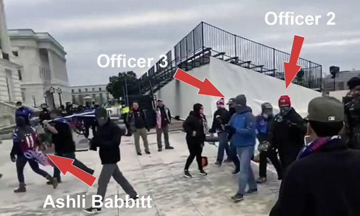 Deux agents infiltrés du Metropolitan Police Department marchent derrière Ashli Babbitt sur le côté nord-ouest du Capitole le 6 janvier 2021. (William Pope-Tribunal de district des États-Unis/Capture d'écran Epoch Times)