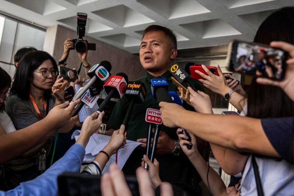 Hong Kong: le chef du syndicat des journalistes condamné pour avoir demandé les raisons du contrôle d'identité