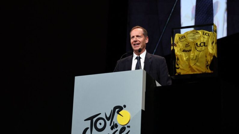 Tour de France General Director Christian Prudhomme speaks in front of the trophy (R) during the presentation of the official routes of the 2024 edition of the men's and women's Tour de France cycling races in Paris on October 25, 2023. Organisers unveiled the 3,492 kilometre route for the men's 2024 Tour de France, which will start in the Italian city of Florence and, with Paris off limits as it prepares to host the Olympics, end on the French Riviera in Nice. (Photo by Anne-Christine POUJOULAT / AFP) (Photo by ANNE-CHRISTINE POUJOULAT/AFP via Getty Images)