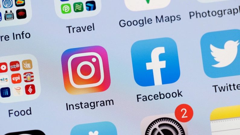 Écran d'un iPhone affichant les applications Facebook, Instagram et Twitter. (Justin Sullivan/Getty Images)
