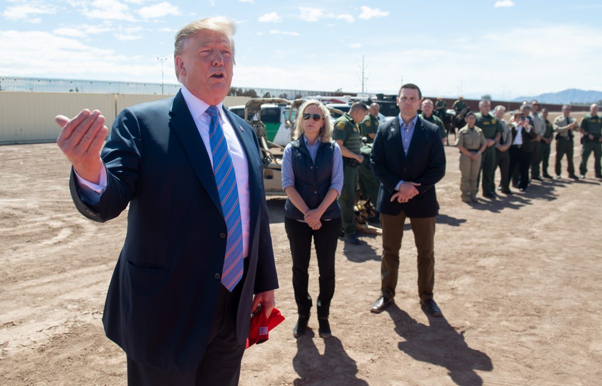 President Donald Trump speaks with members of the U.S. Customs and Border Patrol as he tours the border wall between the United States and Mexico in Calexico